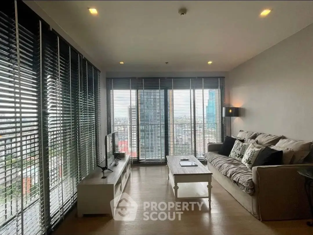 Spacious living room with panoramic city view and modern decor