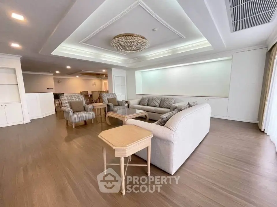 Spacious and elegant living room with luxurious seating and modern decor