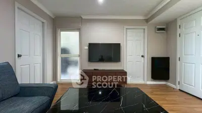 Modern living room with sleek TV setup and stylish furniture