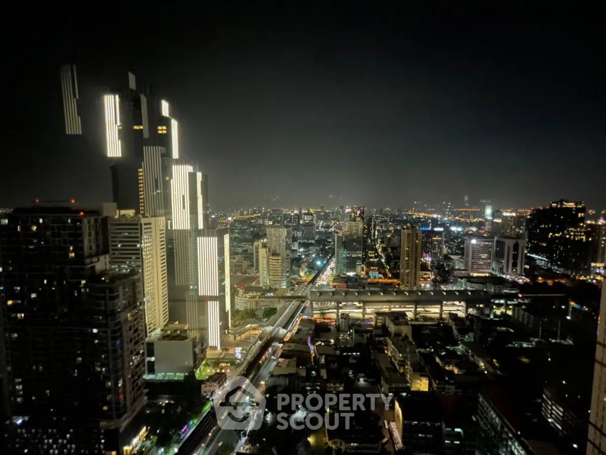 Stunning cityscape night view showcasing illuminated skyscrapers and vibrant urban life.