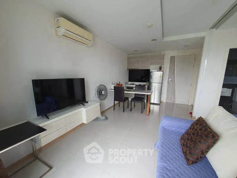 Modern living room with sleek furniture and air conditioning in a stylish apartment.
