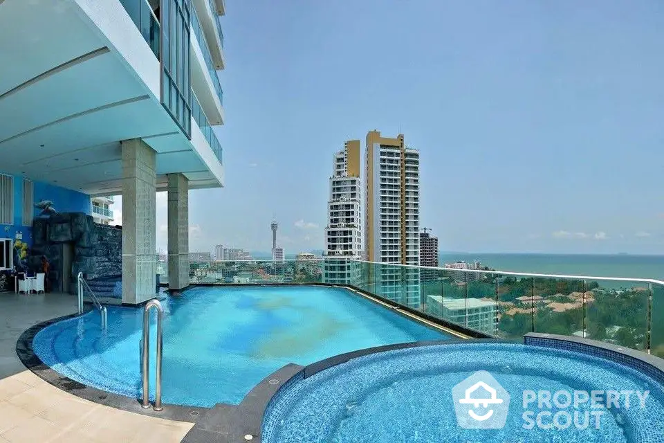 Luxurious rooftop pool with stunning ocean view in modern high-rise building