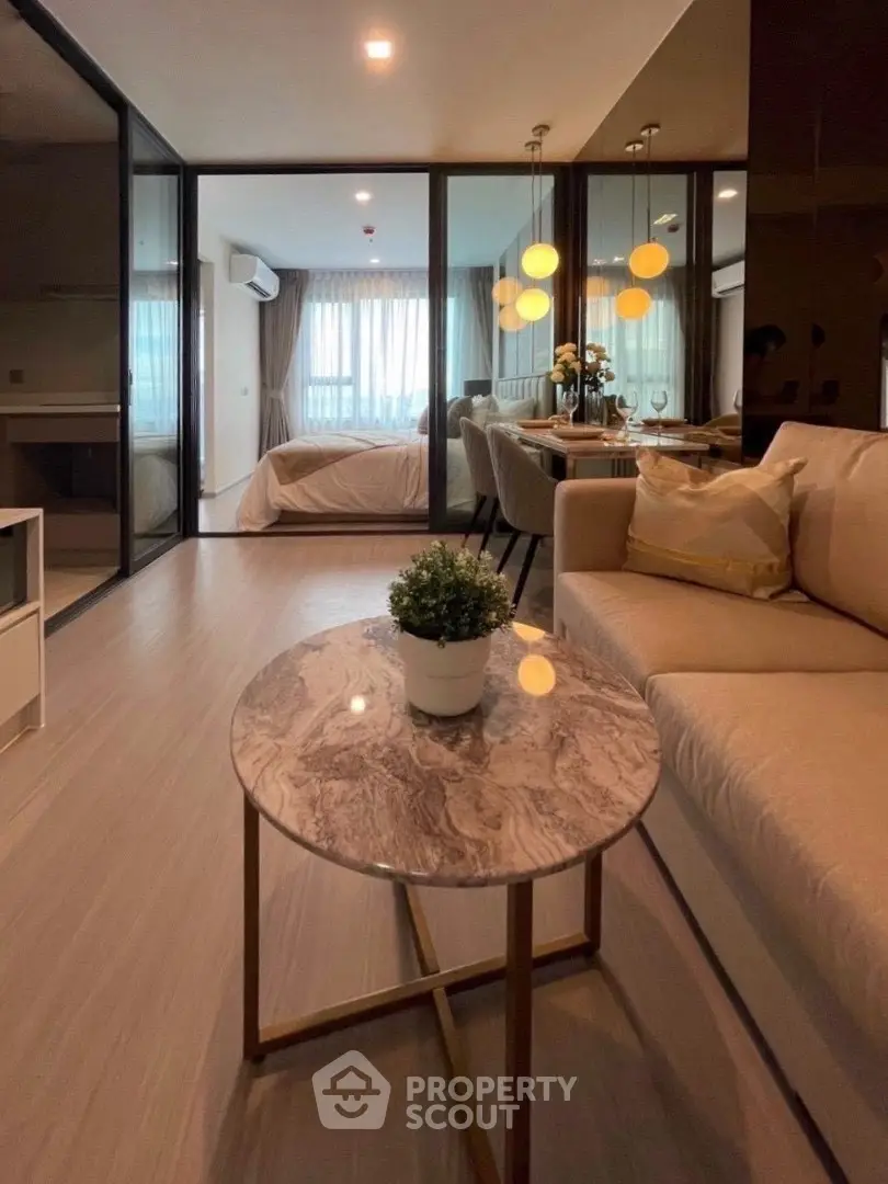 Modern open-plan living room with elegant decor and cozy ambiance