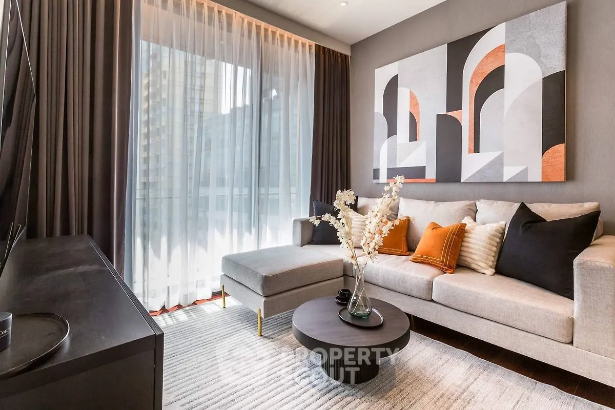 Modern living room with stylish decor and large window view.