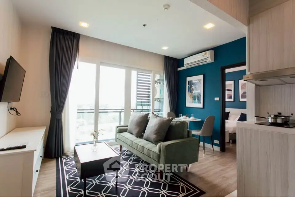 Modern living room with stylish decor and open layout in a high-rise apartment.