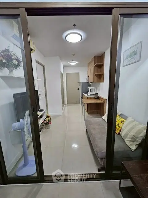 Modern living room with sleek design and cozy seating area, perfect for relaxation and entertainment.