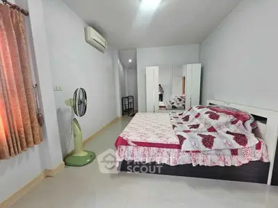 Cozy bedroom with air conditioning and stylish decor in modern home