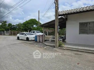 Charming suburban property with ample parking and lush greenery, perfect for a peaceful lifestyle.