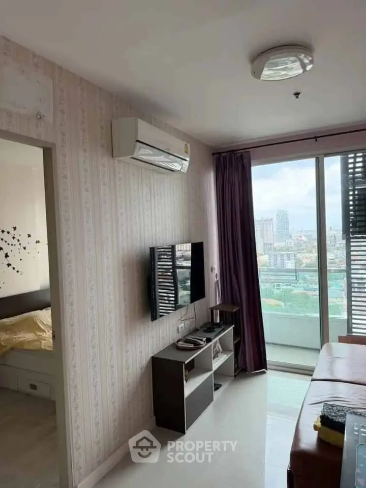 Modern living room with city view, featuring air conditioning and sleek decor.