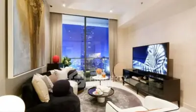 Luxurious modern living room with city view, stylish decor, and large TV