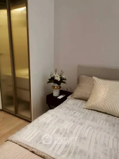 Cozy bedroom with modern decor and elegant bedding