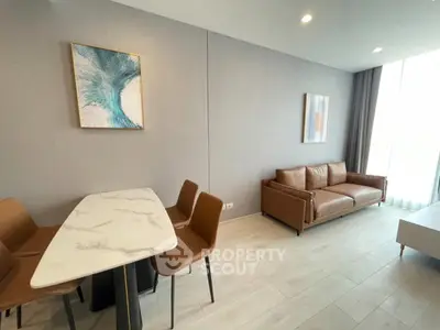 Modern living room with stylish furniture and elegant decor in a bright apartment.