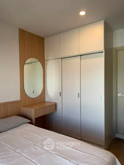 Modern bedroom with built-in wardrobe and stylish wooden accents