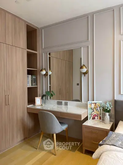 Elegant bedroom with built-in wardrobe and stylish vanity desk