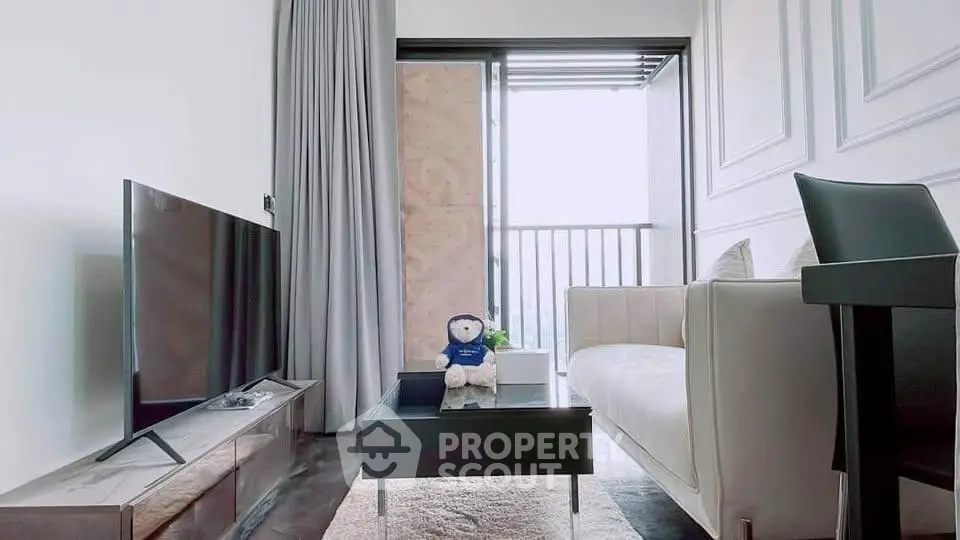 Modern living room with sleek furniture and balcony view