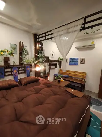 Cozy bedroom with stylish decor and comfortable bedding