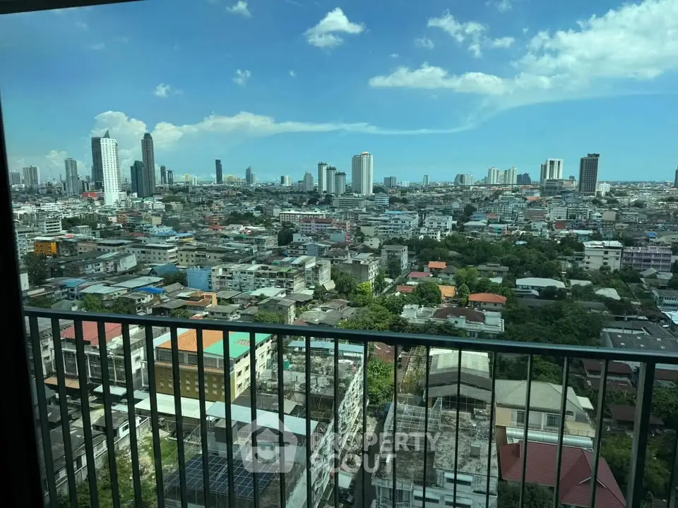 Stunning cityscape view from high-rise balcony with panoramic skyline