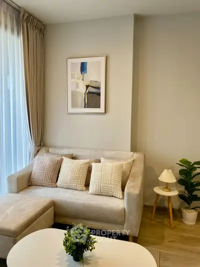 Stylish modern living room with elegant decor and cozy seating area.