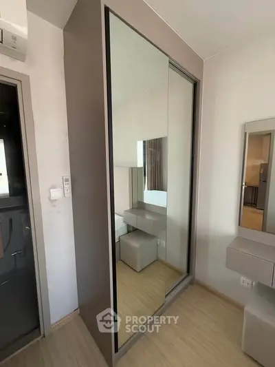 Modern bedroom with mirrored wardrobe and minimalist design