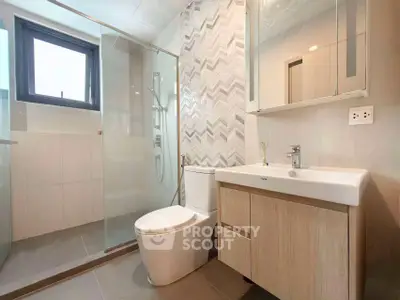 Modern bathroom with sleek design and glass shower enclosure