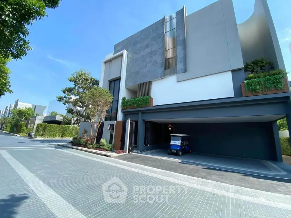 Modern luxury house exterior with sleek design and lush greenery, showcasing contemporary architecture and spacious driveway.