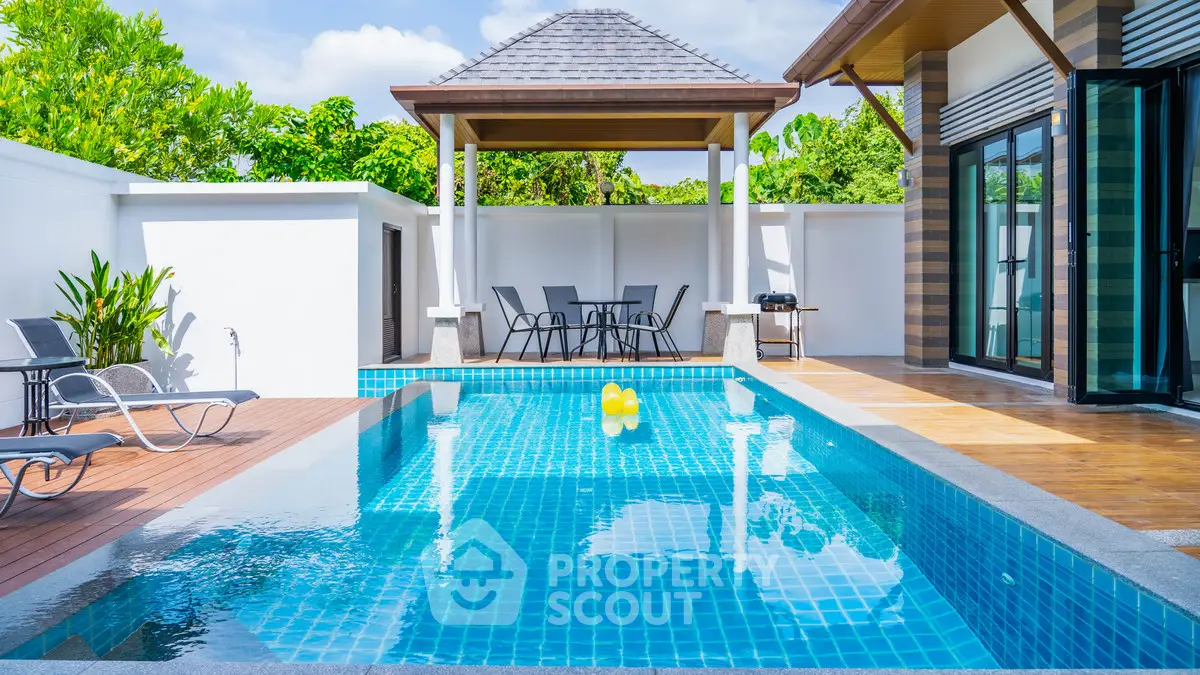 Luxurious villa with private pool and outdoor seating area, perfect for relaxation and entertainment.