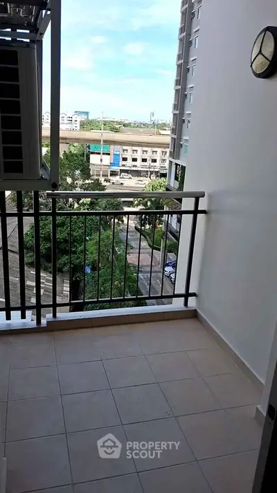 Spacious balcony with scenic view in modern apartment building
