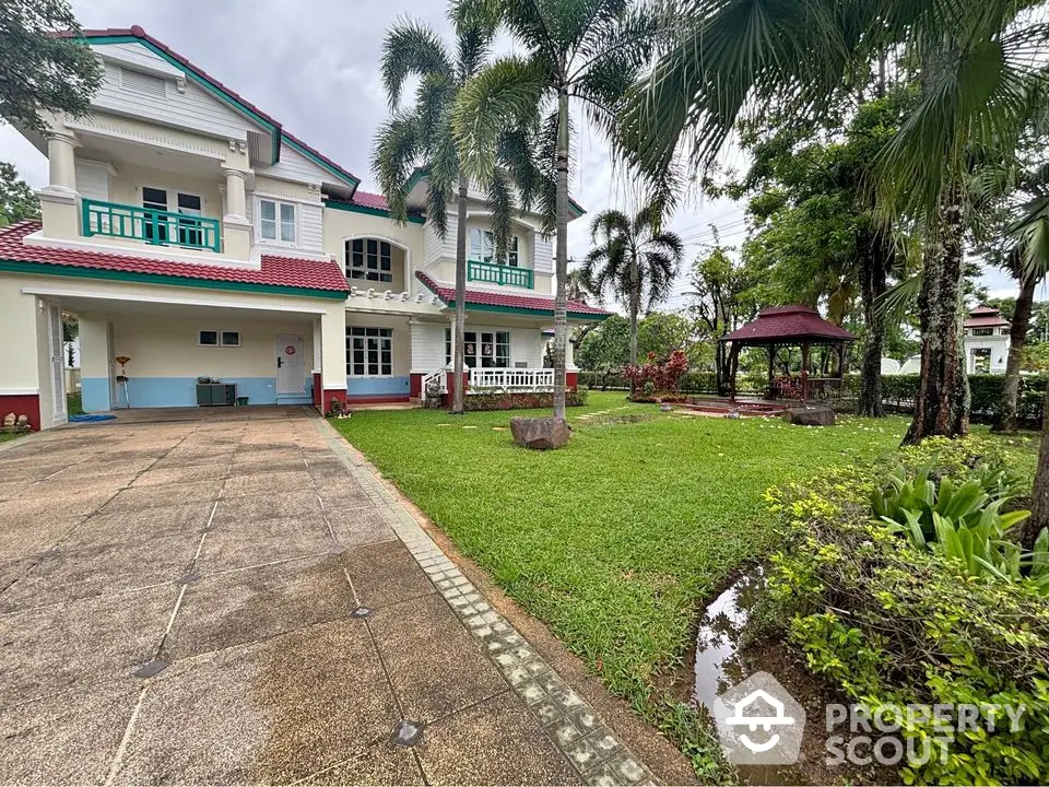 Stunning two-story house with lush garden and gazebo, perfect for family living.