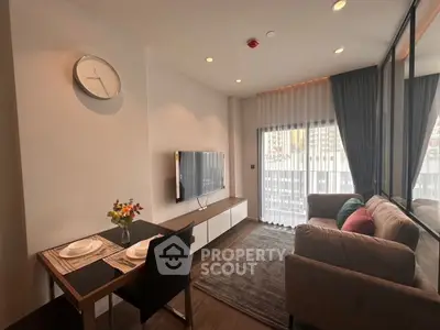 Modern living room with dining area and large window in stylish apartment