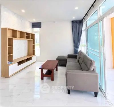 Spacious modern living room with sleek furniture and natural light