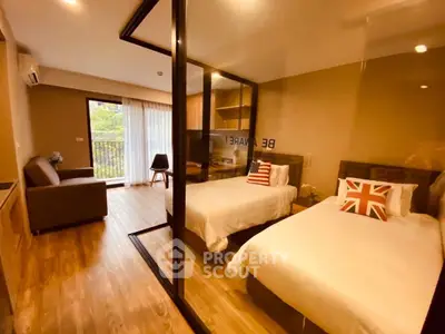Modern twin bedroom with glass partition and balcony view in stylish apartment