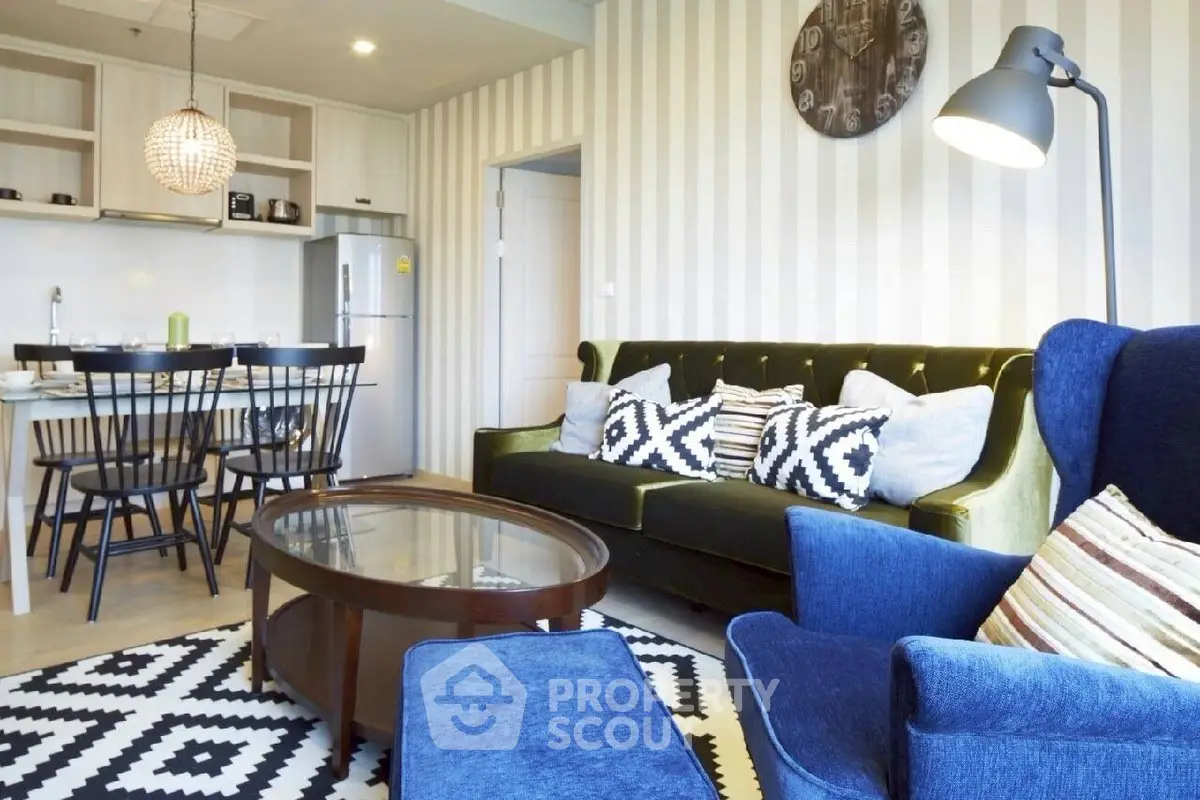 Stylish living room with modern decor and open kitchen layout