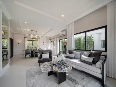 Luxurious modern living room with elegant decor and spacious dining area