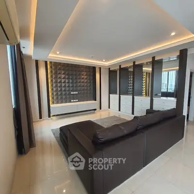 Luxurious modern living room with stylish lighting and sleek leather sofa