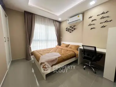 Modern bedroom with stylish decor and natural light