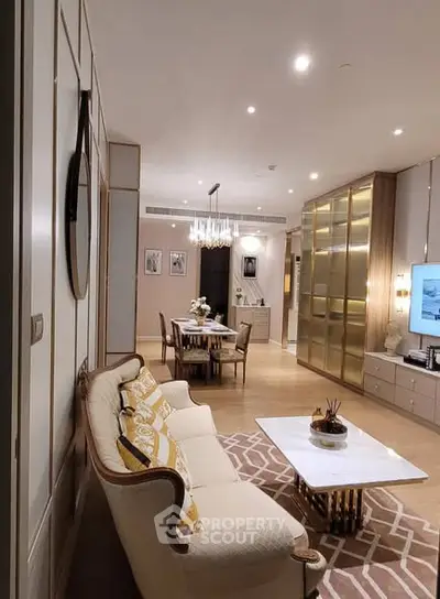 Luxurious open living and dining area with elegant decor and ambient lighting