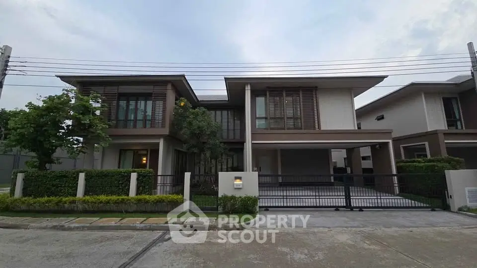 Modern two-story house with sleek design and spacious driveway