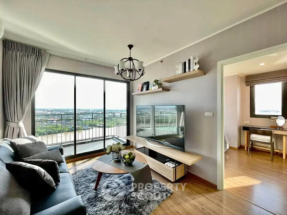 Modern living room with large windows and stunning view, featuring stylish decor and cozy seating area.