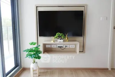 Modern living room with sleek TV setup and stylish decor