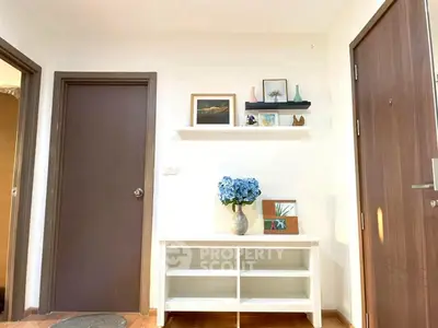 Charming entryway with stylish decor and wooden accents in modern home.