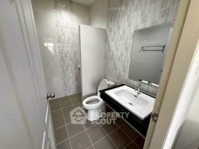 Modern bathroom with sleek tiles and contemporary fixtures