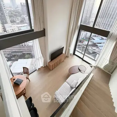 Stunning high-rise living room with floor-to-ceiling windows and city views