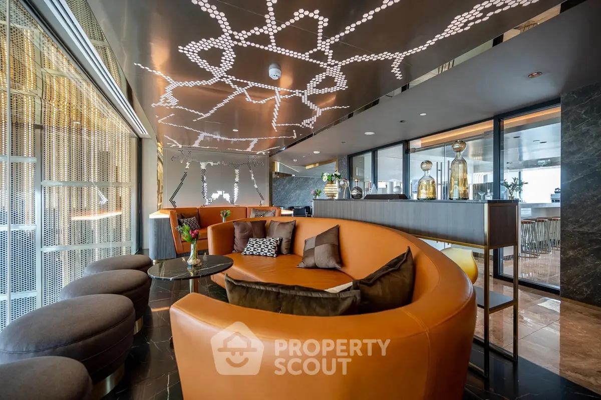 Luxurious modern living room with unique ceiling design and elegant furnishings