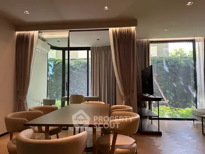 Elegant dining area with garden view and modern furniture