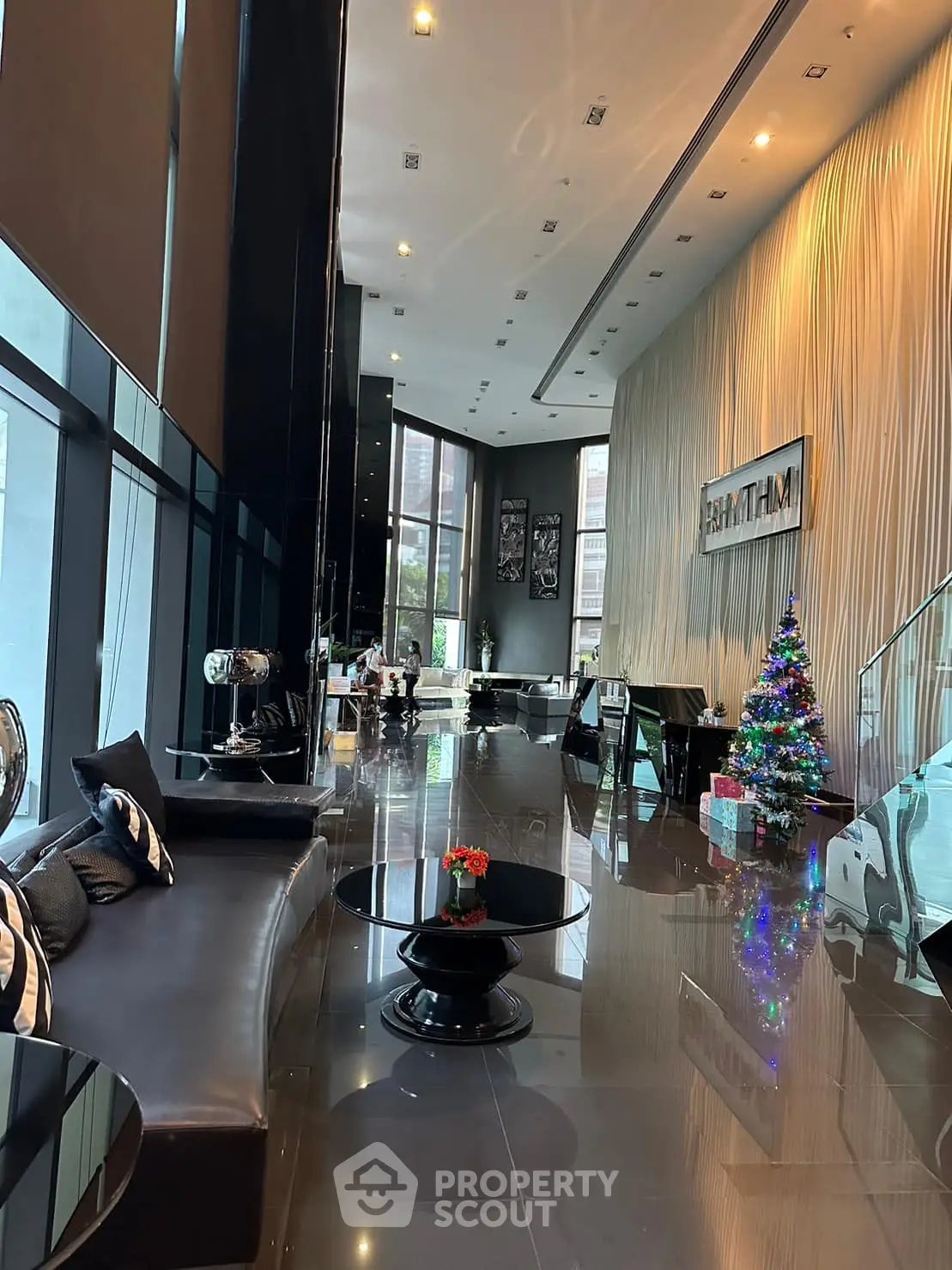 Luxurious modern lobby with high ceilings and festive decor