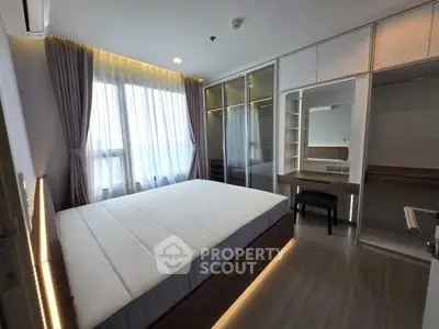 Modern bedroom with large windows and built-in wardrobe in stylish apartment