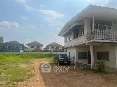 Charming suburban house with spacious yard and ample parking space, perfect for family living.