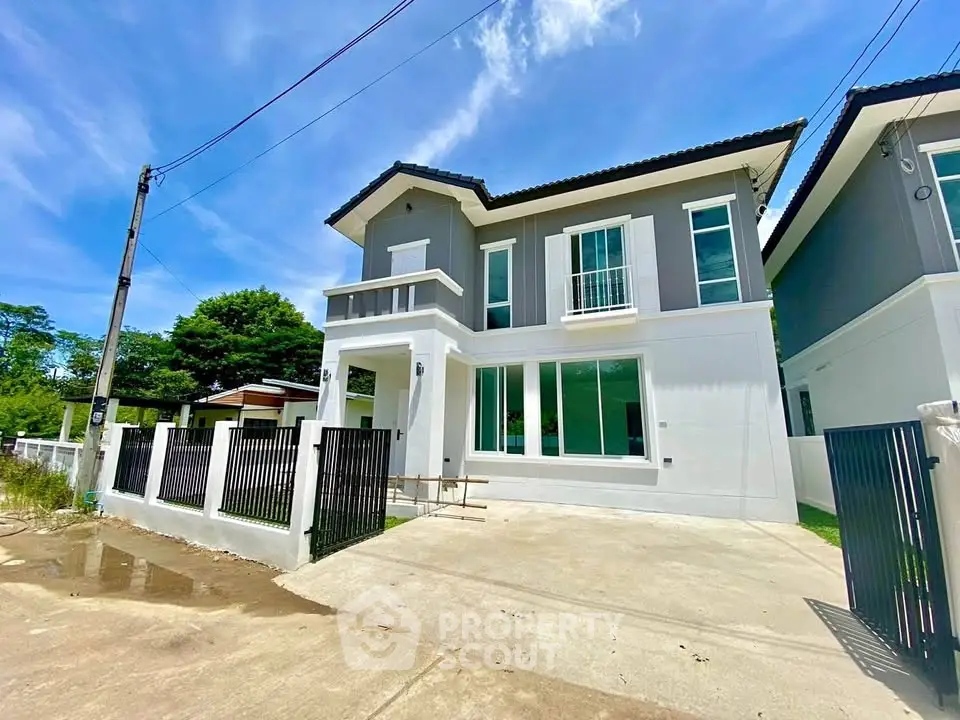 Modern two-story house with sleek design and spacious driveway