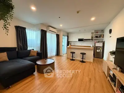 Spacious modern living room with open kitchen and stylish decor