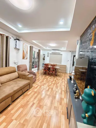 Spacious modern living room with elegant decor and wooden flooring